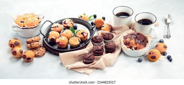 Muffins Assortment On Light Background. Freshly Baked Cupcakes. Celebration Concept. Panorama