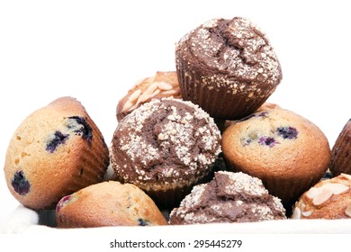 Muffins in basket isolated on a white background