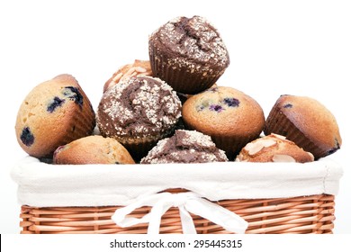 Muffins in basket isolated on a white background