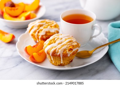 Muffins, Peach Fruit Cupcakes With Cup Of Tea. Marble Background. Close Up.