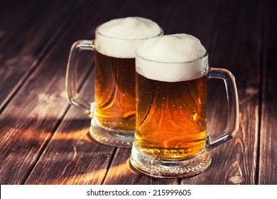 Mug Of Beer On Wooden Background