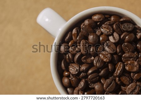 It is a mug and coffee beans.