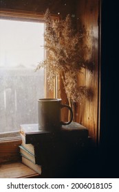 a mug of coffee on a stack of books