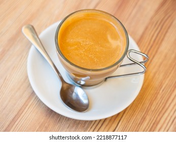 Mug Of Cortado Served On Table In Cafe. Traditional Spanish Coffee.