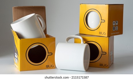 Mug cup and its storage container. One is inside, one is outside, and the other is on the box. Ready to ship mug and shipping box. It is suitable for the use of mug printing and mug sales companies. - Shutterstock ID 2115171587
