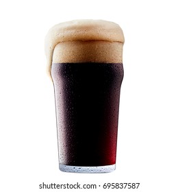 Mug of frosty dark beer with foam isolated on a white background