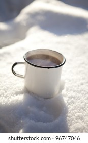 Mug Of Hot Chocolate Outdoors On A Winter Day In Snow