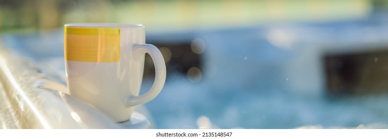 Mug with morning drink on the side of Hot tub hydromassage pool. Illuminated pool. Rest outside the city. Cottage with hydromassage pool BANNER, LONG FORMAT