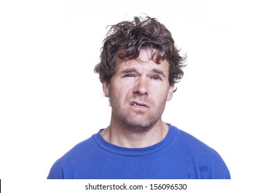 Mug Shot Of Messy Scruffy Drunk Caucasian Man On White Background