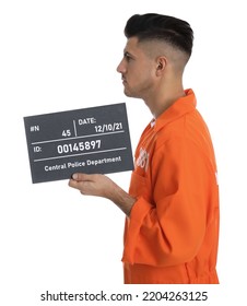 Mug Shot Of Prisoner In Orange Jumpsuit With Board On White Background, Side View