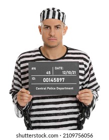 Mug Shot Of Prisoner In Striped Uniform With Board On White Background, Front View