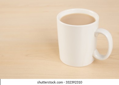 Mug Of Tea On Wooden Table