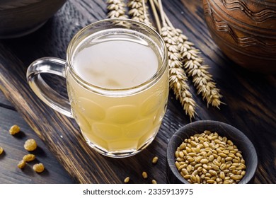Mug of white kvass, fermented drink based on cereals