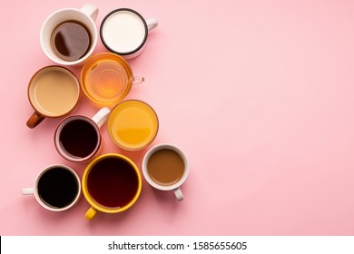 Mugs Glasses With Various Traditional Drinks Coffee Tea Juice On Pink Background. Flat Layout Top View. Drinks Concept.