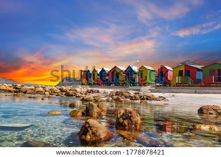 Muizenberg beach huts wooden cabins at twilight in Cape Town South Africa
