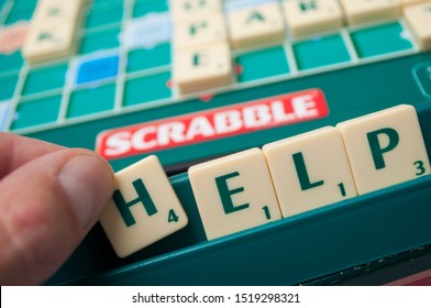 Mulhouse - France - 1 October 2019 - Closeup Of Plastic Letters On Scrabble Board Game Forming The Word : Help