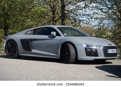 Mulhouse - France - 10 April 2022 - Profile view of grey Audi R8 coupe car parked in the street