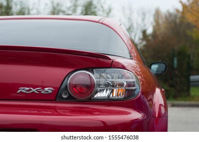 Mulhouse - France - 10 November 2019 - Closeup Of Rear Light And Sign On Red Mazda RX 8 Parked In The Street