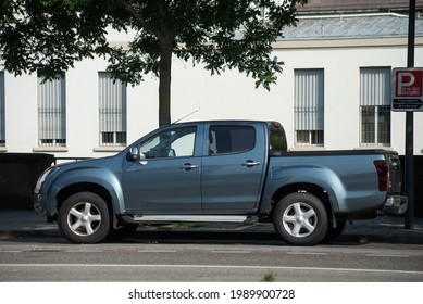 Mulhouse - France - 12 June 2021 - Prfile view of grey Isuzu pickup parked in the street