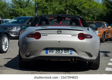 Mulhouse - France - 12 June 2022 - Rear view of new grey Mazda MX5 roadster parked in the street