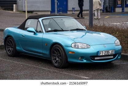 Mulhouse - France - 13 March 2022 - Front view of blue Mazda MX5 convertible parked in the street 