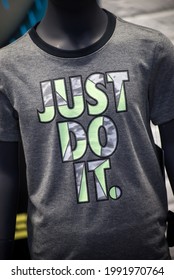 Mulhouse - France - 16 June 2021 - Closeup Of Just Do It Logo By Nike Compagny On Grey Teeshirt In A Fashion Store Showroom