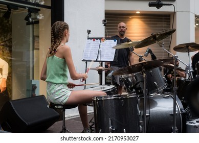 Mulhouse - France - 21 June 2022 - Portrait On Back View Of Blond Teenager Playing Drums In The Street