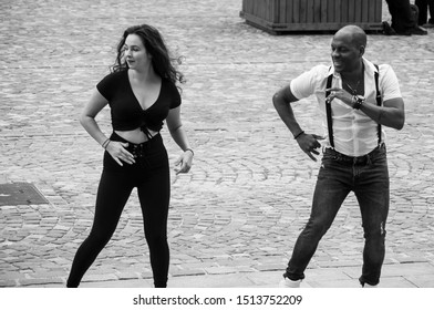 Mulhouse - France - 24 September 2019 - Portrait Of Black Man Dancing Salsa With Girl In The Street 