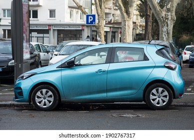 Mulhouse - France 26 January 2021 - Profile view of blue Renault Zoe electric car parked in the street
