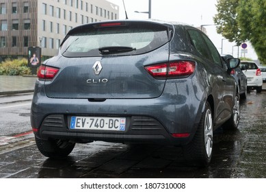 Mulhouse - France - 31 August 2020 - Rear view of grey Renault Clio parked in the street  by rainy day