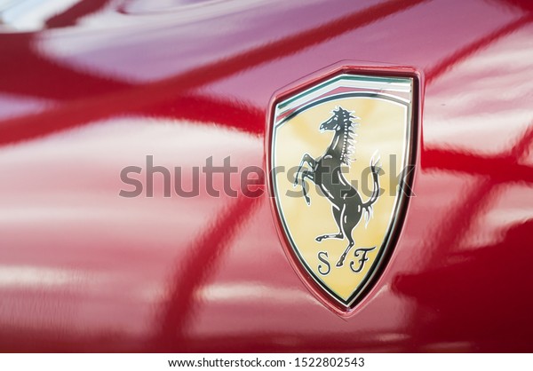 Mulhouse - France - 5\
October 2019 - Closeup of Ferrari logo on red sport car in ferrari\
retailer showroom 