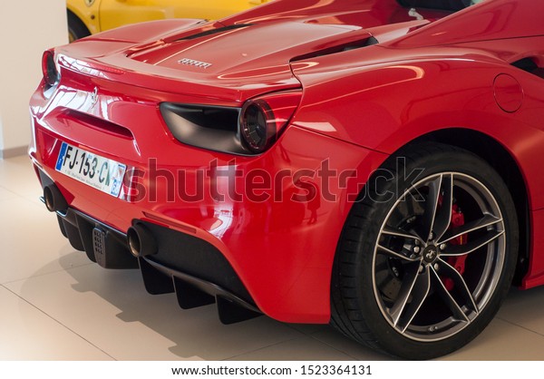 Mulhouse - France - 5 October 2019 -\
Closeup of red Ferrari front in Ferrari retailer showroom\
