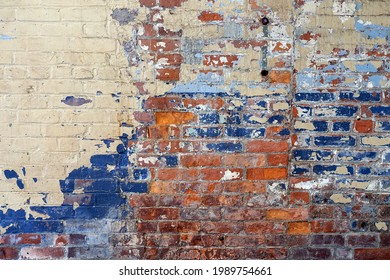 A mulitcolored painted brick wall