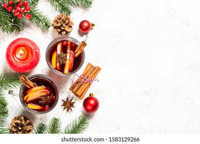 Mulled Wine With Christmas Decorations. Christmas Hot Drink On White Stone Table With Copy Space Top View.