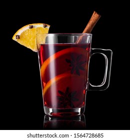 Mulled Wine With Cinnamon And Anise Stars In Glass Mug Isolated On Black Background. Winter Alcoholic Cocktail. Christmas Traditional Drink