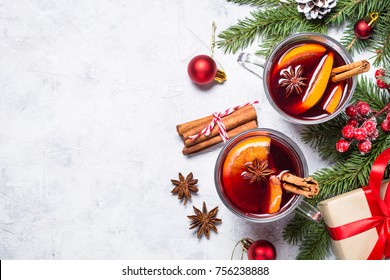 Mulled Wine In Glass Mug With Spices. Christmas Hot Drink On Gray Stone Table. Top View.