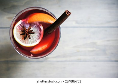 Mulled Wine With Spices On Wooden Background