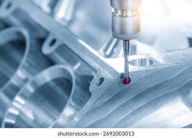 The multi axis CMM machine measuring the aluminum cylinder block parts in the light blue scene. The quality control of automotive parts with multi axis CMM machine.