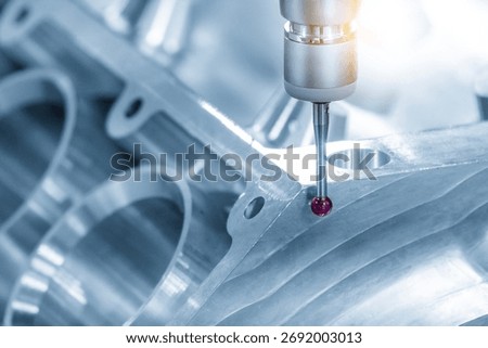 The multi axis CMM machine measuring the aluminum cylinder block parts in the light blue scene. The quality control of automotive parts with multi axis CMM machine.