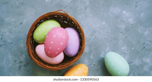 Multi clored Polka dots Easter eggs in a basket
