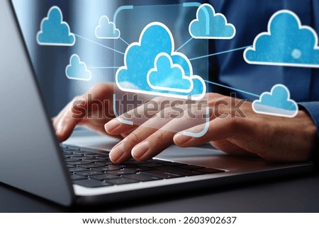 Multi cloud management and orchestration. Cloud interoperability and integration. Engineer using laptop computer to manage and optimize cloud computing systems.