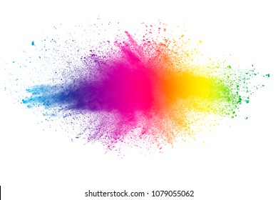 Multi color powder explosion on white background. Launched colorful dust particles splashing.