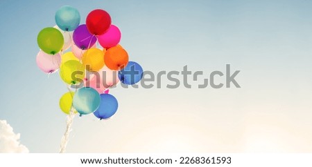 multi colored balloons done with a retro vintage  filter effect. concept of festival, celebration, birthday, for background design.