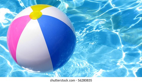 Multi Colored Beach Ball In Swimming Pool