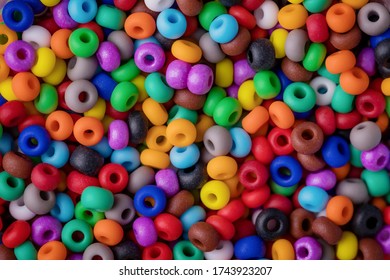 Multi colored beads texture background. Colorful round small beads, full frame shot