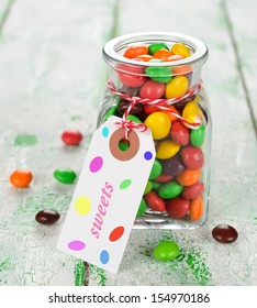 Multi colored candy on a white table