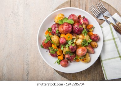 Multi Colored Food. Roasted or boiled Potatoes in bowl on light Background. top view