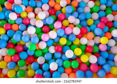 Multi Colored, Highly Saturated Plastic Balls, In Soft Play Ball Pit, At A Child's Play Park