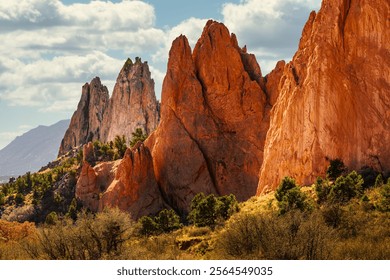 MULTI COLORED JAGGED ROCK FORMATIONS AND A NICE CLOUDYSKY AT THE GARDEN OF THE GODS IN COLORADO SPRINGS COLORADO