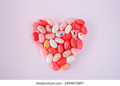  Multi colored jelly beans laid out in the shape of a heart                               - Powered by Shutterstock